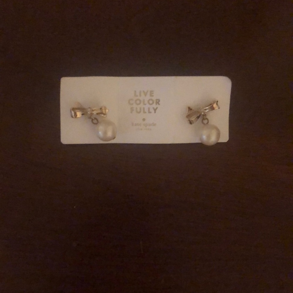 Kate Spade gold and pearl bow dangly earrings